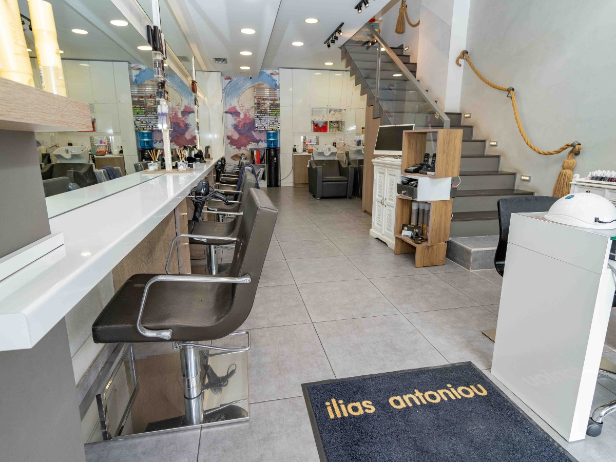 Well-lit salon space with mirrors and hairdressing stations