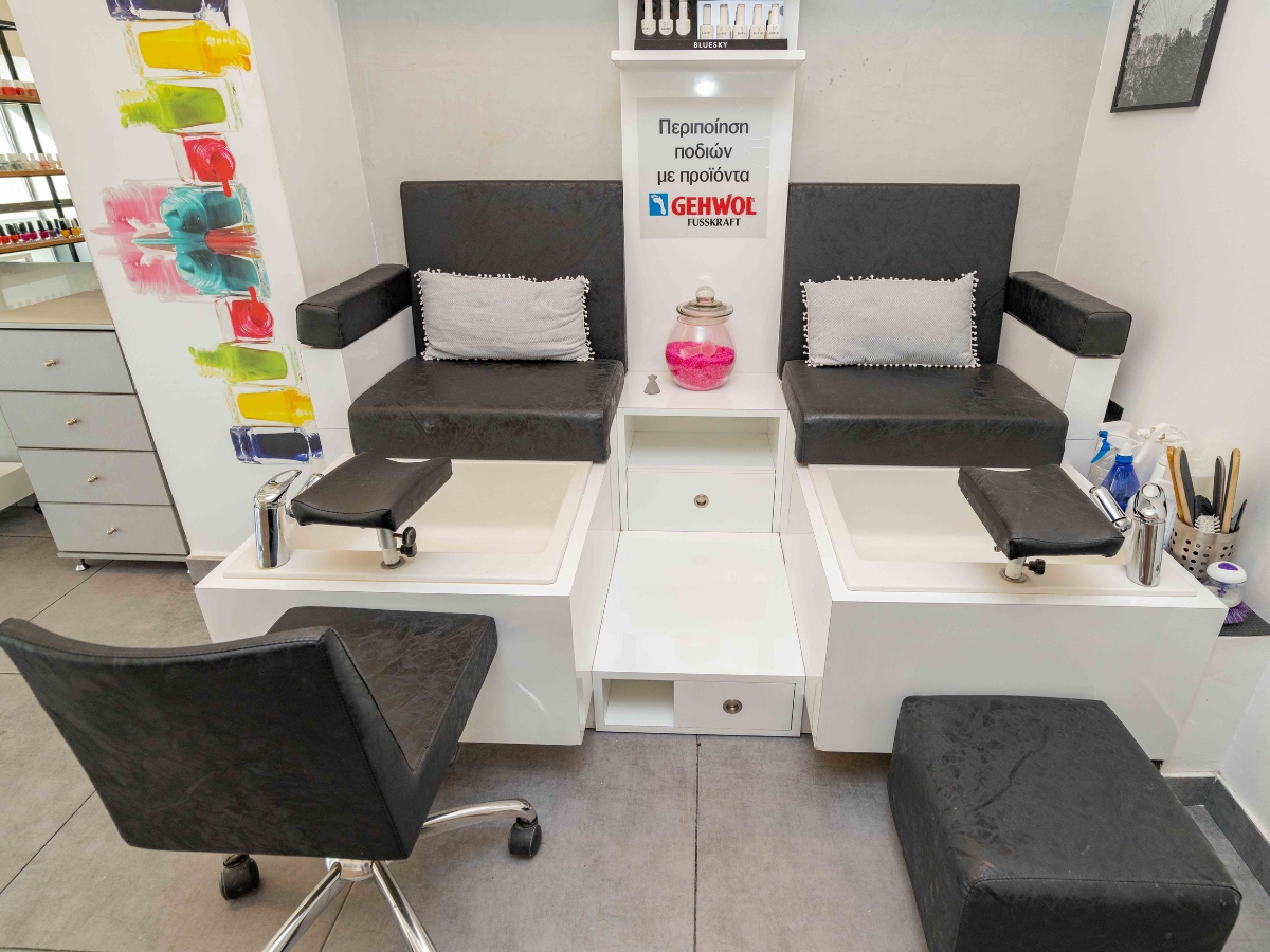 Modern and stylish pedicure area with comfortable seating and nail stations